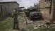 Разруха и изгорели танкове и камиони с характерния за Русия