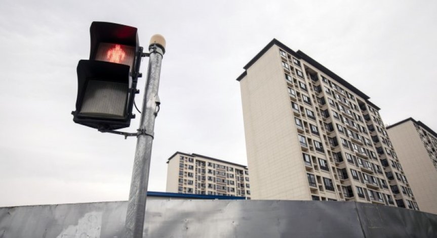 Задлъжняла до уши китайска компания продаде дял за $1,1 млрд. заради падеж